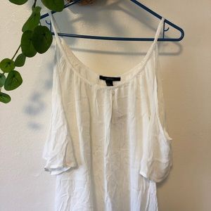White flowy open-shoulder summer dress.